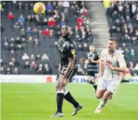  ?? Chelsie Wilson ?? Macc debutant Natheron Cameron in action against MK Dons