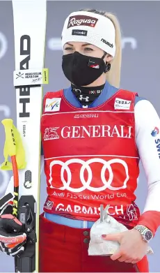  ??  ?? Lara Gut-Behrami reacts during the winners ceremony after the Women's Super-G event.