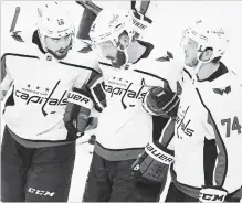  ?? TAMPA BAY TIMES FILE PHOTO ?? Washington Capitals defenceman Brooks Orpik, centre, gets helped off the ice by centre Chandler Stephenson and defenceman John Carlson (74) after getting checked by Tampa Bay Lightning centre Cedric Paquette in Game 7 of the Eastern Conference final.