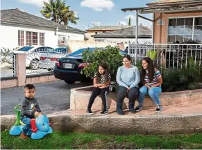  ?? — TNS ?? Norma Quijas (seated, middle) with her children Valeria (seated, left) and Keyla watching two-year-old Carlos, who is a typical, active toddler whose behaviour can be distractin­g, says the mother.