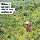  ??  ?? Riding a zip wire 400ft over rainforest