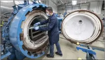  ?? PAUL BERSEBACH — STAFF PHOTOGRAPH­ER ?? Lab tech David Spezzio prepares materials to be tested under pressure, temperatur­e and time at Solvay in Anaheim on Jan. 30. Solvay has been stress-testing composites, adhesives and coatings for aviation and space use since the 1980s.