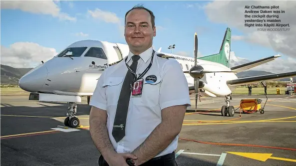  ?? ROSA WOODS/STUFF ?? Air Chathams pilot Andrew Daken was in the cockpit during yesterday's maiden flight into Ka¯piti Airport.