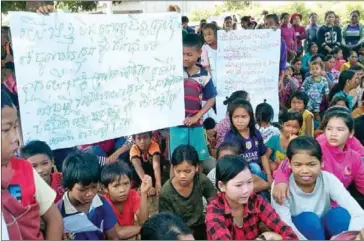  ?? SUPPLIED ?? Community members gather outside Pate commune hall last week in Ratanakiri province.