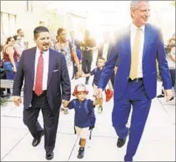  ?? GO NAKAMURA ?? Schools chief Richard Carranza (l.) and Mayor de Blasio flank eager Ethan at Queens’ PS 377. Top, Stuyvesant freshman Safina Davis says specialize­d high schools should use multiple admission measures. Above r., Corally Camargo, who is critical of Bronx schools, and son Elliot.