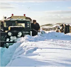  ??  ?? Jones (above) digging his rescue vehicle out of the snow and (below) in 1963