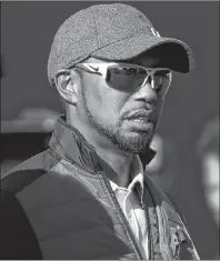  ?? AP PHOTO ?? In this Sept. 27, 2016, file photo, United States vice-captain Tiger Woods watches a practice round for the Ryder Cup golf tournament at Hazeltine National Golf Club in Chaska, Minn.