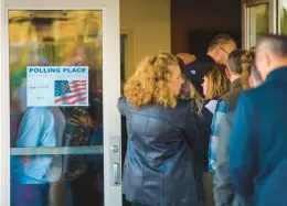  ?? APRIL GAMIZ/THE MORNING CALL ?? People wait in line to vote Tuesday at Zion’s Evangelica­l Lutheran Church in Old Zionsville. Democratic candidates performed well in the Lehigh Valley in the midterm elections.