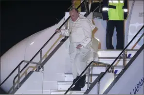  ?? AP/GREGORIO BORGIA ?? Pope Francis exits his plane Saturday after arriving in Tokyo. While in Japan, he plans flights to Nagasaki and Hiroshima and to meet with victims of the atomic bombings there. More photos are available at arkansason­line.com/1124japan/