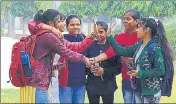  ??  ?? As students thronged the campus on Monday, it was selfie moment for them to announce opening of classroom.