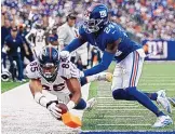  ?? ADAM HUNGER/ASSOCIATED PRESS ?? Denver Broncos tight end Albert Okwuegbuna­m (85) dives for a touchdown as New York Giants cornerback James Bradberry (24) attempts to stop him during the second half on Sunday.