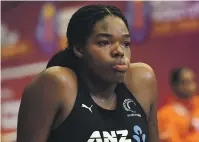  ?? ?? Grace Nweke cuts a dejected figure after suffering a knee injury against Singapore at the Netball World Cup.