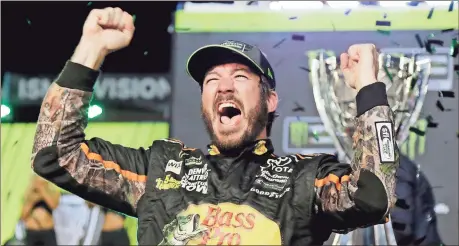  ??  ?? Terry Renna / AP Martin Truex Jr. celebrates Sunday after winning the NASCAR Cup Series race and season championsh­ip at Homestead-Miami Speedway in Homestead, Fla.