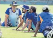  ??  ?? Jharkhand captain M S Dhoni (left) with teammates during a