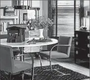  ?? CHICAGO TRIBUNE ?? In a small space, a glass-top dining table creates the illusion of space, and pedestal tables allow more knee room.