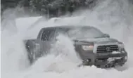  ?? JOHN MAHLER FOR THE TORONTO STAR ?? Deep snow traction requires dedicated winter tires. The rubber stays flexible so the vehicle can dig for traction.