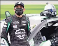  ?? John Raoux / Associated Press ?? Kyle Larson stands next to his car before the Daytona 500 on Feb. 14 at Daytona Internatio­nal Speedway in Daytona Beach, Fla.