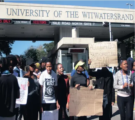  ?? Picture: DIMPHO MAJA ?? ANGRY: Students gather outside Wits University’s Empire Road entrance, where they protested against the cost and lack of infrastruc­ture at the Yale Village residence.