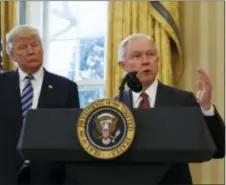  ?? PABLO MARTINEZ MONSIVAIS — THE ASSOCIATED PRESS FILE ?? In this file photo, President Donald Trump listens as Attorney General Jeff Sessions speaks in the Oval Office of the White House in Washington, after Vice President Mike Pence administer­ed the oath of office to Sessions. In invoking Hillary Clinton’s...