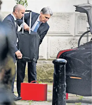  ??  ?? Philip Hammond was spotted at Downing Street yesterday loading suitcases into his official car, sending Whitehall tongues wagging