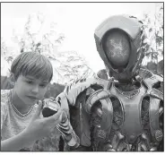  ??  ?? Netflix’s lavish reboot of Lost in Space features Max Jenkins as young Will Robinson, with Brian Steele inside the futuristic suit of Robot.