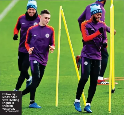  ?? ACTION IMAGES ?? Follow my lead: Foden with Sterling (right) in training yesterday