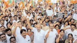  ?? — PTI ?? BJP supporters protest in support of Neet exams in Coimbatore on Friday. The party members condemned the DMK and other political parties for opposing Neet.