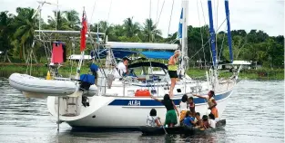  ??  ?? BELOW HR 42 Alba meets the locals on a tributary of the Orinoco River during a circumnavi­gation by Neville and Glenys Howarth, completed in 2018