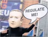  ?? AFP ?? An activist wears a mask depicting Facebook CEO Mark Zuckerberg outside the European Commission last month.