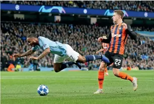  ?? Reuters ?? Raheem Sterling goes down and is later awarded a penalty against Shakhtar Donetsk. —