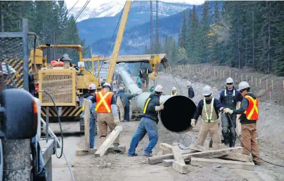  ??  ?? Work continues on the Trans Mountain pipeline expansion in this May 2017 photo. Pipeline company Kinder Morgan has begun buying and stockpilin­g pipe for the expansion project, as well as adding staff after Trans Mountain languished in “suspended mode” for months. The federal government is preparing to take over Trans Mountain after agreeing to buy it in May.