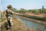  ?? — AP ?? An armyman patrols the Munak canal in Haryana on Monday. The Delhi government had sought help of Army engineers for repairs to the canal.