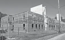  ?? KYLE ROBERTSON/ COLUMBUS DISPATCH ?? A number of affordable housing units are being built in Franklinto­n, like this one at 1137 W. Broad St., as seen on Sept. 24.