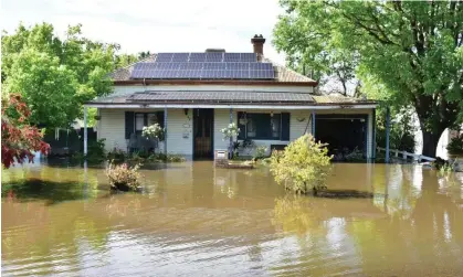  ?? Photograph: Lucy Cambourn/AAP ?? Flood waters have started receding in Forbes, New South Wales, while an evacuation order is in place for Kenley on the Murray River in Victoria.