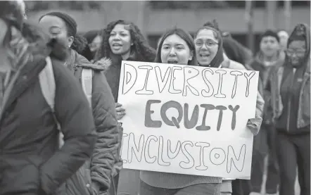  ?? CLARE GRANT/COURIER JOURNAL ?? University of Louisville students chants as they march to Grawemeyer Hall during a rally March 18 held by University of Louisville students to protect diversity, equity, and inclusion (DEI) on their campus.