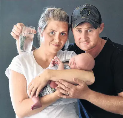  ?? PHOTO: PETER MCINTOSH ?? Troubled waters . . . Concerned Waikouaiti parents Rachel and Richard Olsen are worried about the health of their 1weekold baby Gretel.