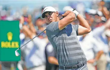  ?? Brian Ciancio / TNS ?? Brooks Koepka tees off on the first tee during the final round of the 2018 U.S. Open on Sunday. Koepka won the U.S. Open for the second consecutiv­e year after finishing 1-over.