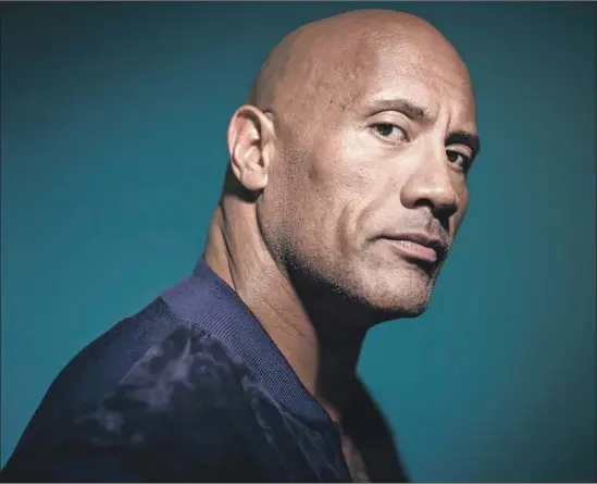  ?? Marcus Yam Los Angeles Times ?? DWAYNE Johnson and other Polynesian actors perform a traditiona­l Samoan war dance in “Hobbs,” which he kept secret from his mother. The surprise made her cry.