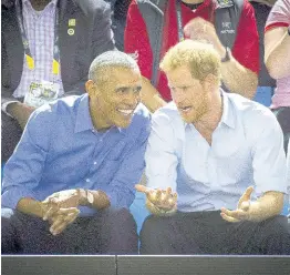  ?? ?? Former US President Barack Obama, centre left, and Britain’s Prince Harry watch wheelchair basketball at the Invictus Games in Toronto in September 2017.