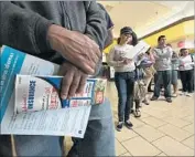  ?? Irfan Khan Los Angeles Times ?? PEOPLE STAND in line at an enrollment event sponsored by Covered California, the state’s healthcare insurance exchange, in Panorama City in 2014.