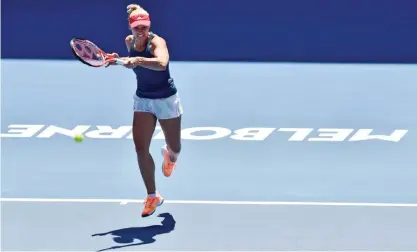  ??  ?? MELBOURNE: Angelique Kerber of Germany hits a return during a practice session ahead of the Australian Open tennis tournament in Melbourne yesterday. — AFP