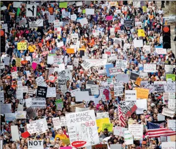  ?? ASSOCIATED PRESS ?? A LARGE CROWD FILLS the streets during the March For Our Life Atlanta rally Saturday. The Atlanta police department estimated the crowd at near 30,000 people. Students and activists across the country planned events in conjunctio­n with a Washington...