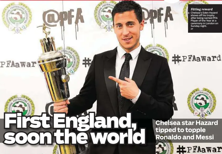  ??  ?? Fitting reward Chelsea’s Eden Hazard shows off his trophy after being named PFA Player of the Year at a ceremony in London on Sunday night.
AP