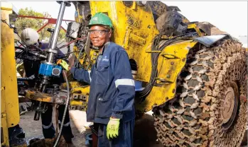  ?? ?? Employees working on a machine at Combined Technical Services, a youth-led enterprise based
in Ngezi that provides local engineerin­g products and services