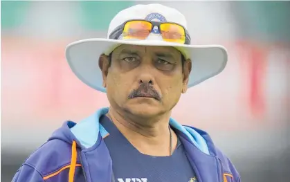  ?? Photos / AP ?? India head coach Ravi Shastri (above and below) has refused to heed Covid-19 protocols.