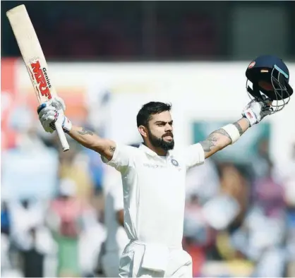  ?? Associated Press ?? India’s captain Virat Kohli celebrates after completing a double century against Sri Lanka during the third day of their second Test in Nagpur on Sunday.