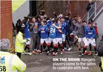  ??  ?? ON THE BRINK Rangers players come to the gates to celebrate with fans