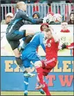 ??  ?? Montreal Impact keeper Evan Bush (left), leaps over team-mate Maxim Tissot and Toronto FC’s Steven Caldwell to make a save during the second half of an MLS soccer match, on Oct 18, in Toronto. (AP) WASHINGTON, Oct 19, (AP): Chris Pontius and Eddie...