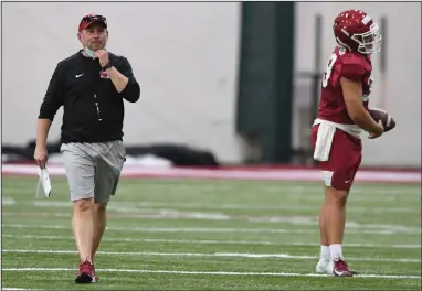  ?? (NWA Democrat-Gazette/J.T. Wampler) ?? Scott Fountain (left), Arkansas’ new special teams coordinato­r, held the same position at Georgia last season and followed Coach Sam Pittman to Fayettevil­le. He has been an assistant for teams that reached the national championsh­ip game three times. “He is 100% dedicated to special teams, which is special,” kicker A.J. Reed said.