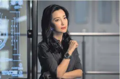  ??  ?? Underwater thriller: Li Bingbing stars in The Meg alongside Jason Statham, with partner Rosie Huntington-Whiteley (below)